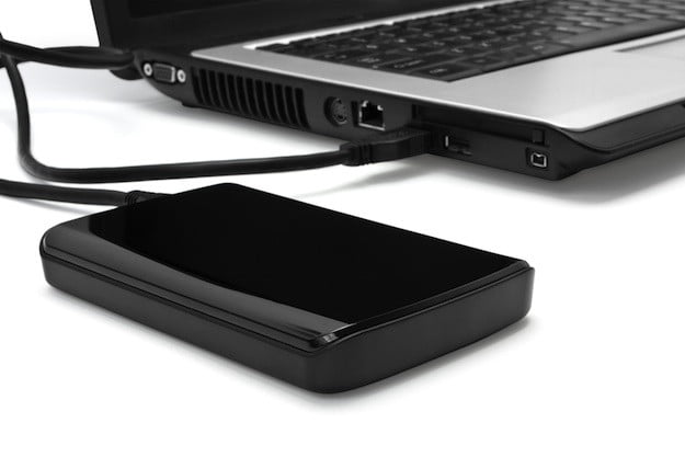 A laptop connected to an external hard drive.