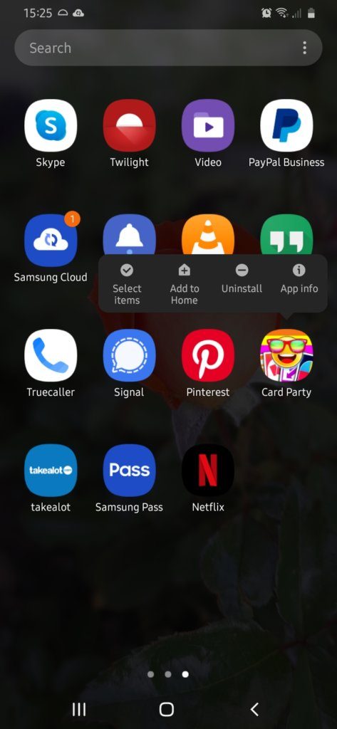 A screenshot of a smartphone screen with apps and showing how to hold an app icon and then click the uninstall option.