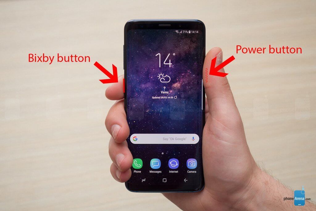 A man holding a Samsung Galaxy S9 showing where to press Bixby button and Power button