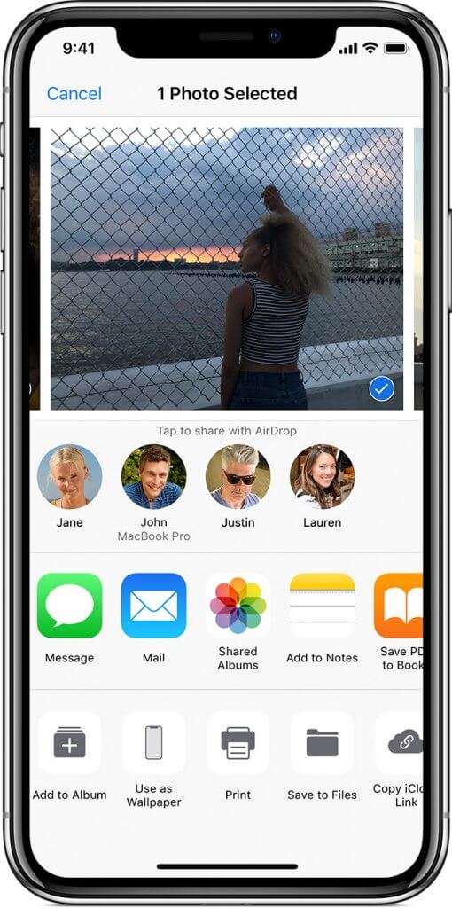 A photo of an iPhone showing how to select and share a photo 